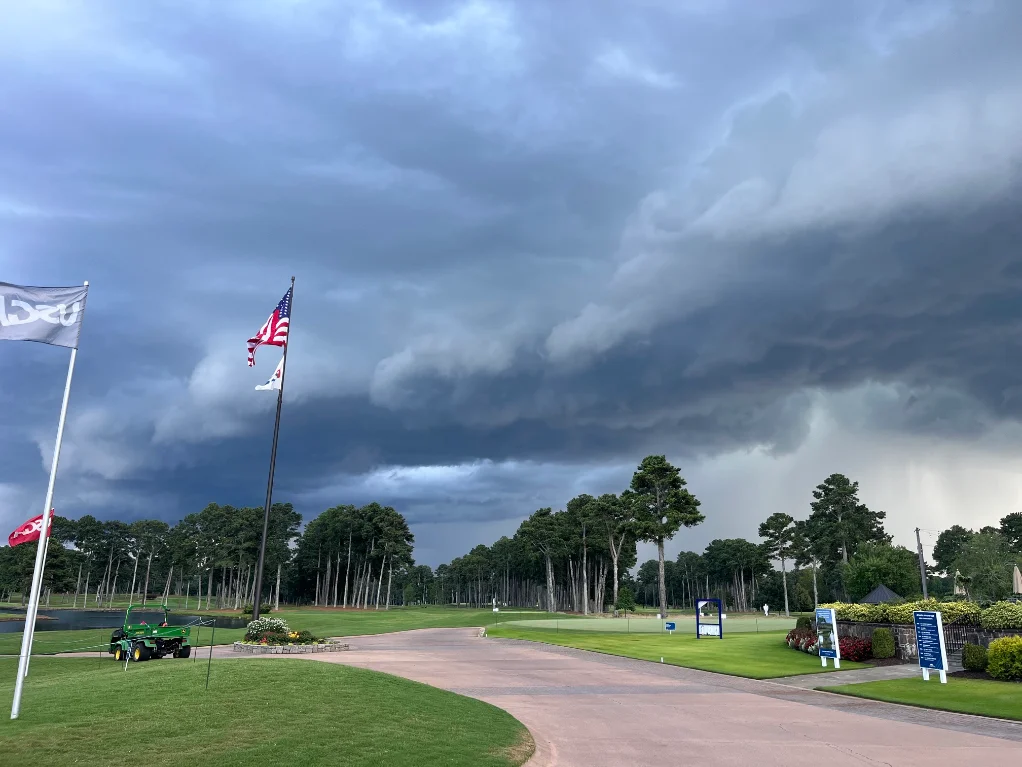 Storm clouds rolling over an outdoor event venue